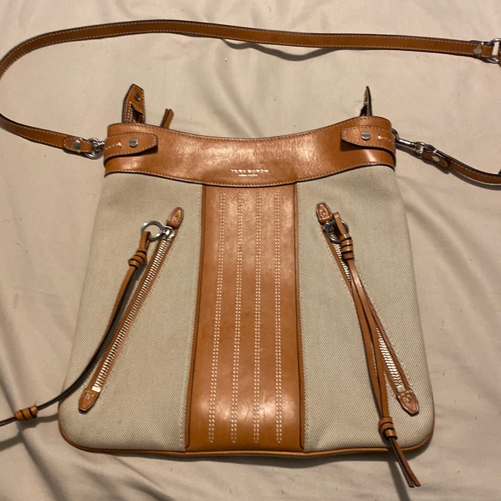 Tan fabric and leather cross body Tory Burch bag.